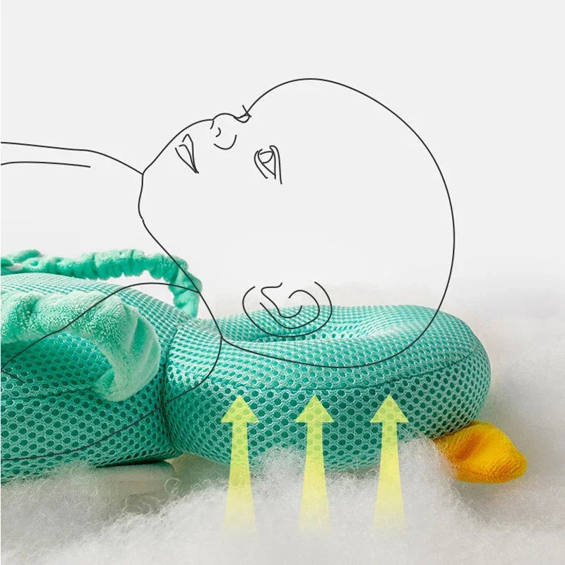 Teal mesh pillow with yellow arrows indicating airflow on a white background